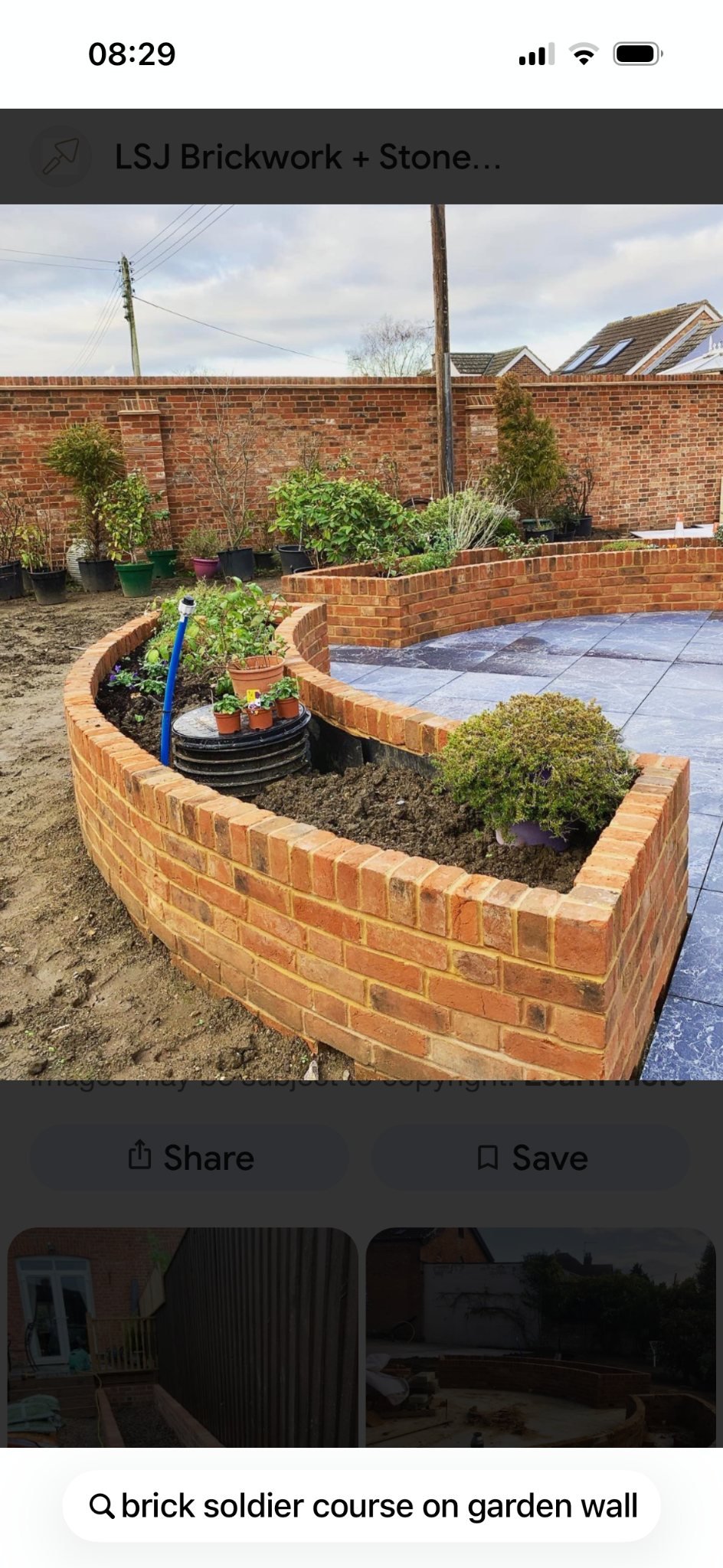 Curved brick planter and landscaped garden