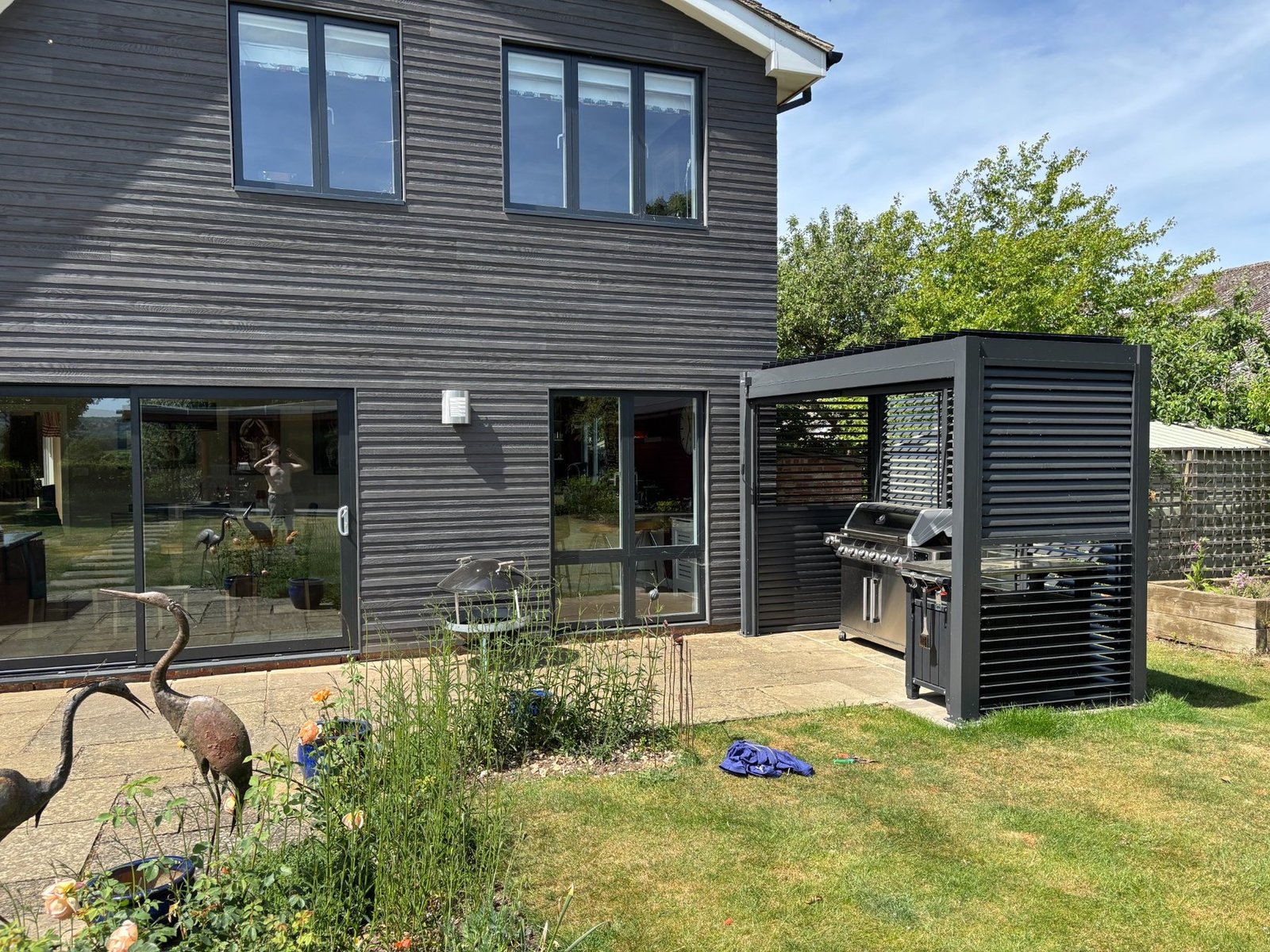 Outdoor kitchen and entertaining enclosure